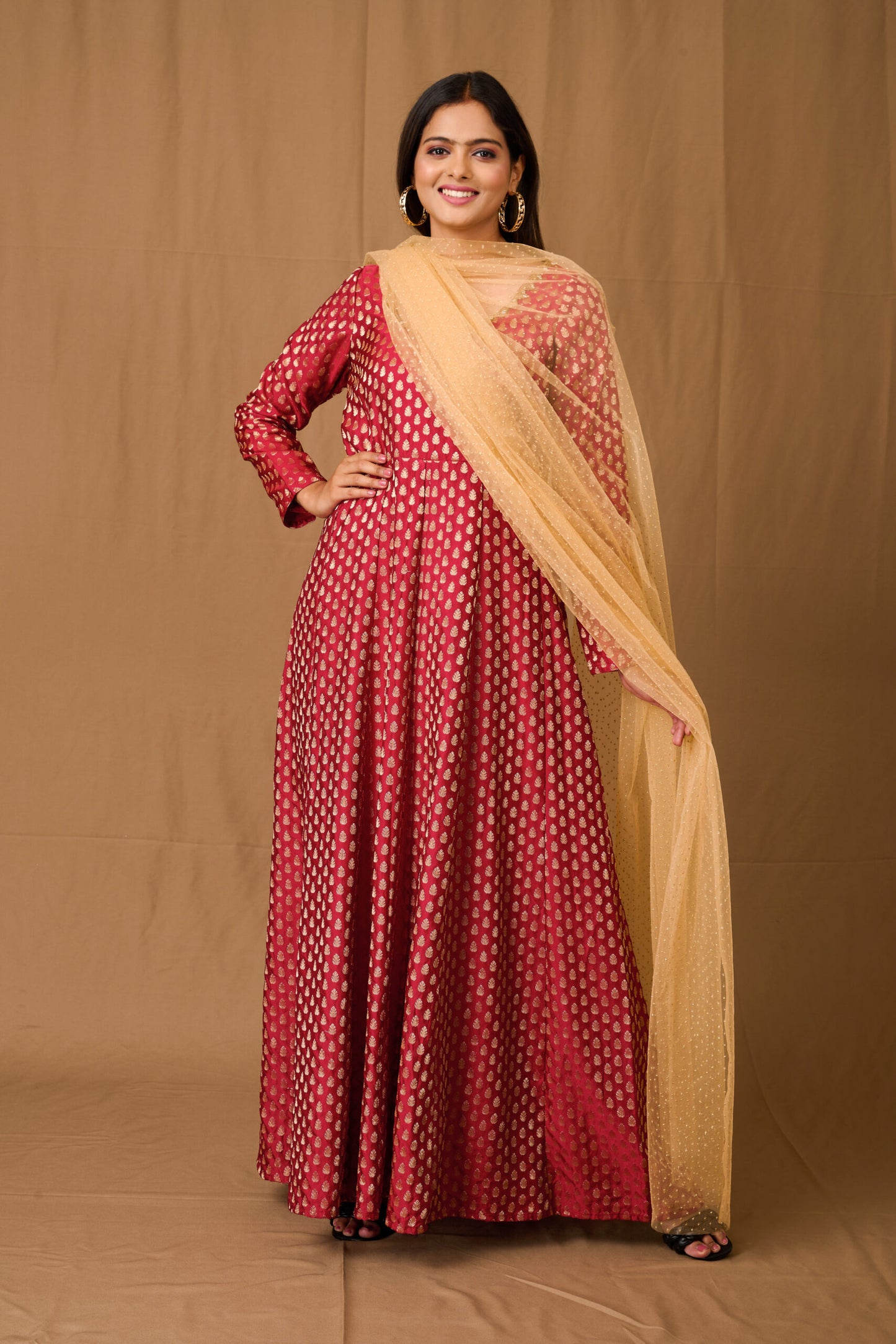 Banarasi style marron gown with zari and buta lace