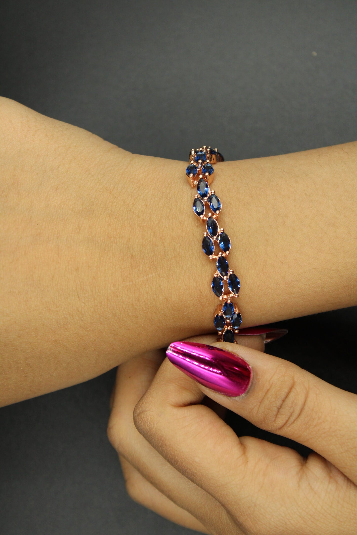 Classic design gold plated bracelet with Dark blue stones