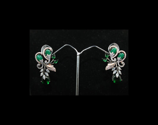 Fancy stud earring with dark green stones